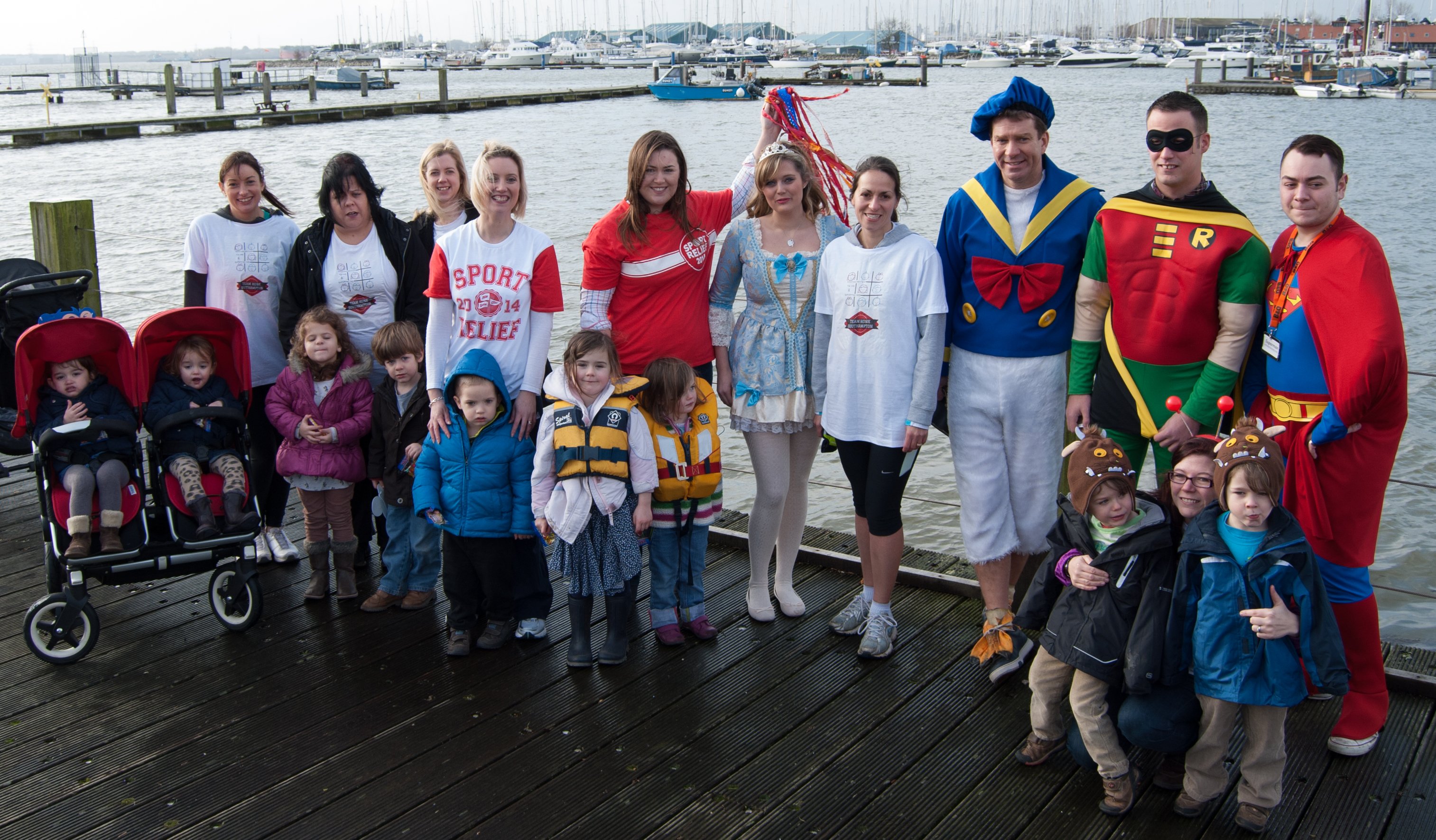 Hading over the baton from TJ Marine to me, Lisa, twin families and B&Q staff in fancy dress